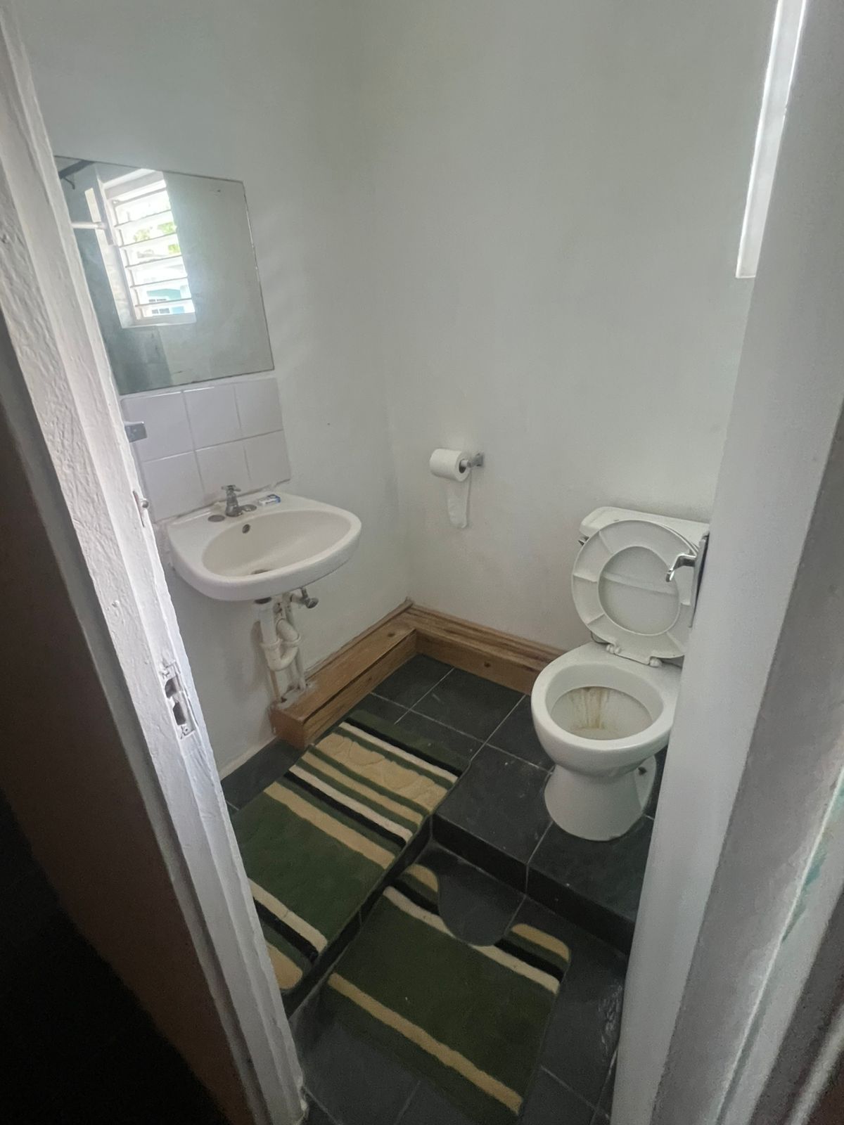 Bathroom with sink and toilet